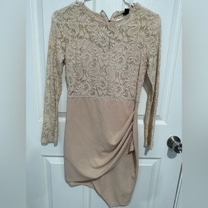 Dress is in the color cream and is in good condition